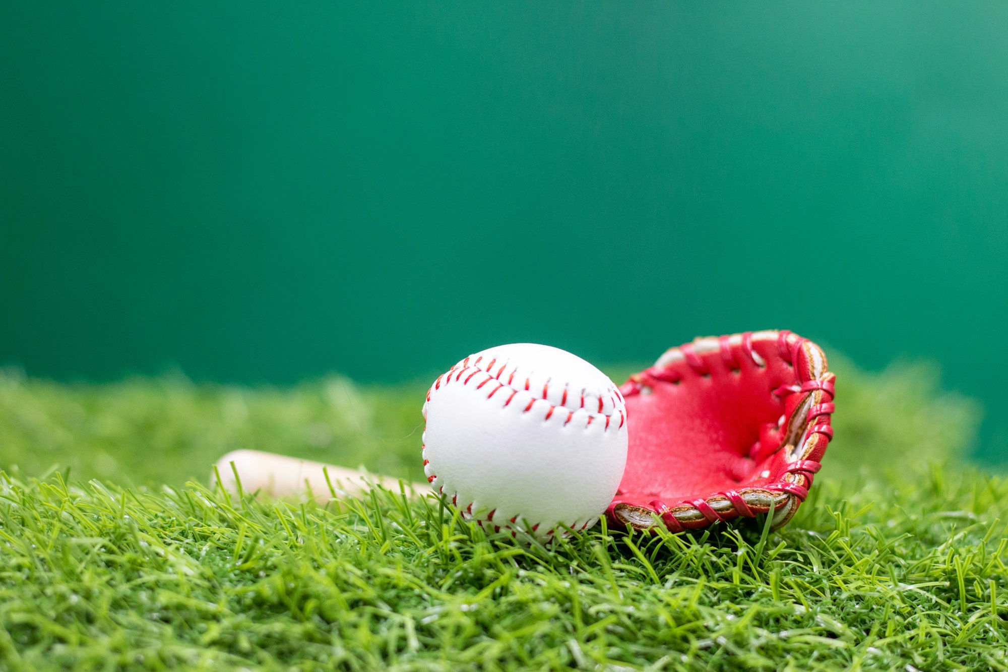 Baseball is on green grass